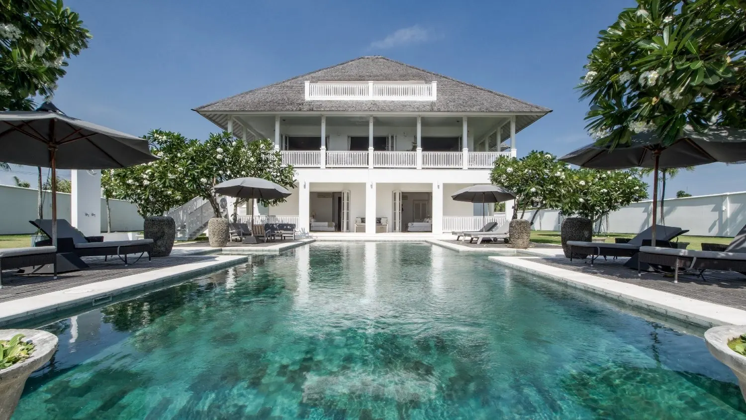 The villa rising behind the 16 by 6 metre pool