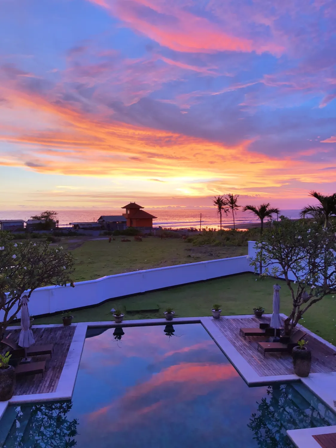 Sunset reflected in The Palms pool